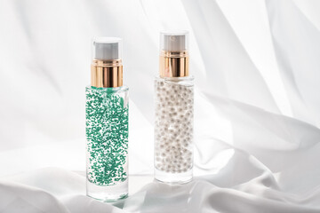 Skincare serum and make-up primer gel bottle, moisturizing lotion and lifting cream emulsion,...