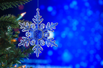 Christmas and background.Toy in the form of a transparent star on a Christmas tree, background for...