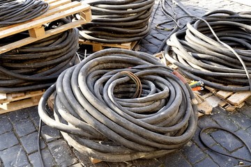 Rolled power cable on brick