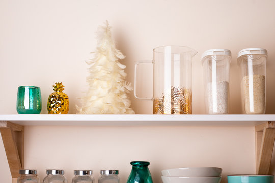 Christmas decoration on kitchen shelf on the wall