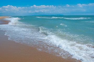 Restless noisy sea in the summer. The feeling of an approaching storm
