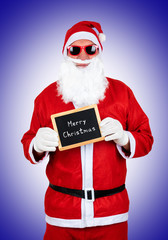 santa claus with sunglasses and hat with text merry christmas