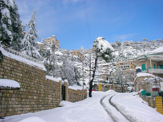 Beautiful landscape of mountainous town in winter, many cozy cottage, eco tourism,Deir El Kamar mountains in Lebanon, wintertime holidays concept