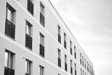 Contemporary apartment building. Generic residential architecture. Black and white.