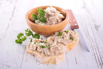 bowl of tuna spread, canape with spread