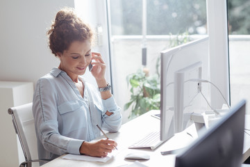 Businesswoman Working on a Desktop Computer