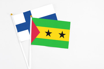 Sao Tome And Principe and Finland stick flags on white background. High quality fabric, miniature national flag. Peaceful global concept.White floor for copy space.