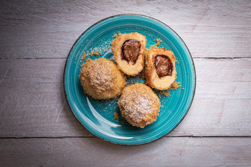 Bread crumb dumplings stuffed with chocolate and nuts