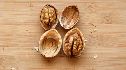 Walnuts kernels on wooden desk with color background, Whole walnuts and Half walnuts	