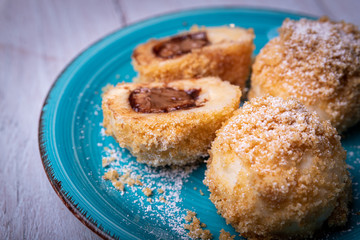 Fototapeta na wymiar Bread crumb dumplings stuffed with chocolate and nuts