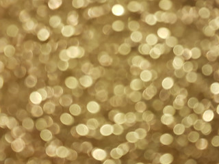 gold blurred bokeh of light for abstract background 