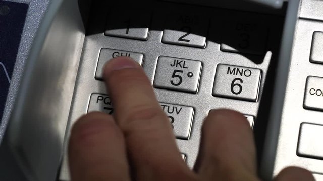 Slow motion, man input personal identification number in ATM, Automatic Teller Machine