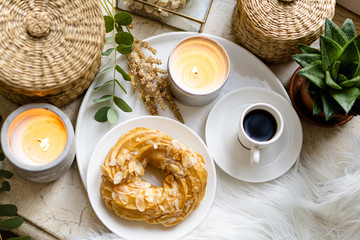 Simple real breakfast with coffee and custard cake on white plate