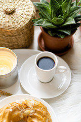 Simple real breakfast with coffee and custard cake on white plate