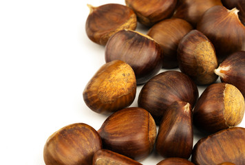 Chestnuts with shell isolated on white background, a pile of fresh chestnuts