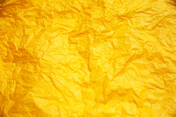 Rumpled yellow background. Real texture of the wrapping texture.