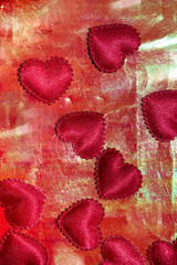 Bright red vertical background with hearts, ideal for Valentine's day.