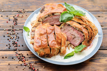 beef tenderloin festive dish. baked meat in dough