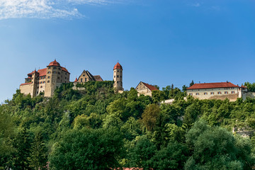 Full view of Harburg Castle from the Wörnitz riverbank. Photography taken in Harburg, Bavaria,...
