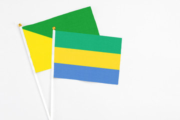 Gabon and French Guiana stick flags on white background. High quality fabric, miniature national...