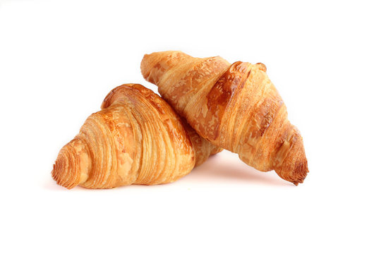 Two french croissant  isolated on white background