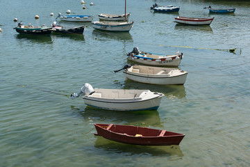 Fototapeta na wymiar many small rowboats and dinghy in the harbor and port of Doelan