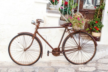Fototapeta na wymiar Decorative Bike on the Street of the City of Ostuni, Apulia, Italy