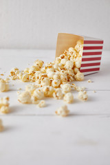 Full of tasty caramel popcorn in classic striped box..