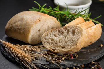 Italian ciabatta bread cut in slices. - obrazy, fototapety, plakaty