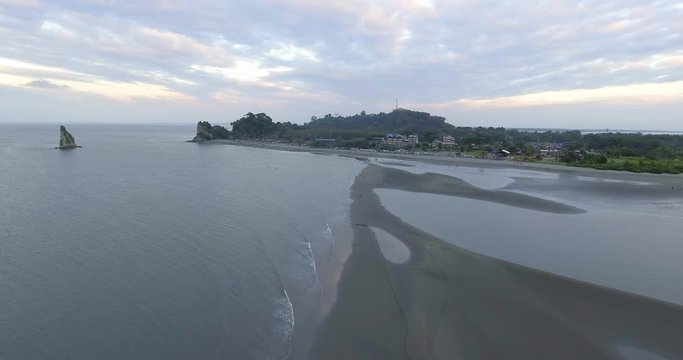 Panoramic View of the Beach and Stone Shaped Like a Piece of Cheese
