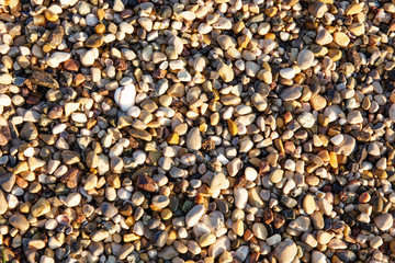 Pebbles in the beach, abstract outdoor background