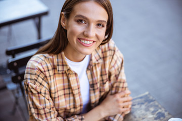 Beautiful lady waiting for a friend in a cafe