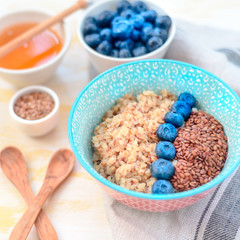 buckwheat porridge with fruits and honey, chia seeds, flax seeds, the concept of a healthy breakfast, diet, veganism, vitamins