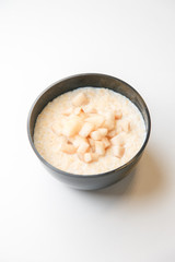 Delivery of porridge and soup in a container. A bowl of soup on a white background.