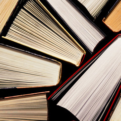 Lots of multi-colored books with multi-colored bookmarks close-up