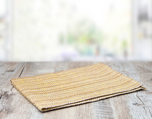 Yellow texture napkin on a wooden table