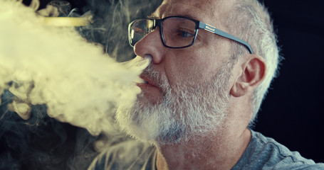 Man smoking a controversial vape is a health risk