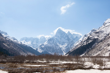 Caucasus mountains covered with snow in spring,
