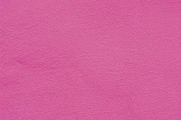 Background of a pink stucco coated and painted exterior, rough