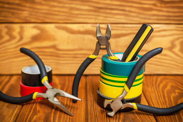 Three insulating tape for electrician on vintage wooden boards