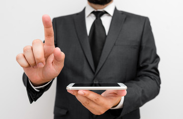Male human wear formal work suit hold smart hi tech smartphone use one hand