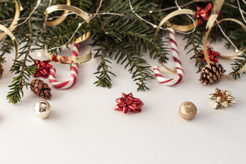 ...Christmas decorative background with pine branches,candy and christmas ball on the white background. Christmas Holiday Concept. copy space..