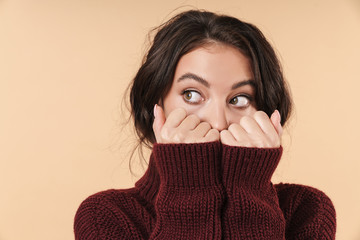 Woman posing isolated covering face with hands.