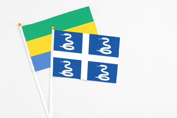 Martinique and Gabon stick flags on white background. High quality fabric, miniature national flag....