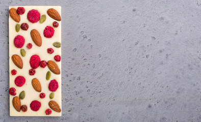 White chocolate bar over grey background