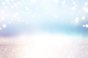 Fototapeta premium abstract glitter silver, gold and blue lights background. de-focused