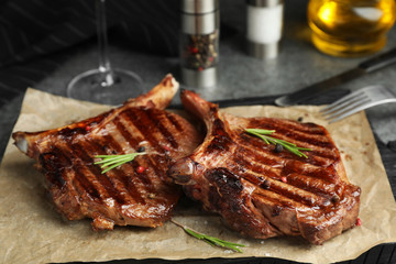 Delicious beef steaks served on table, closeup