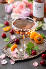 Wineglass filled  with  rose