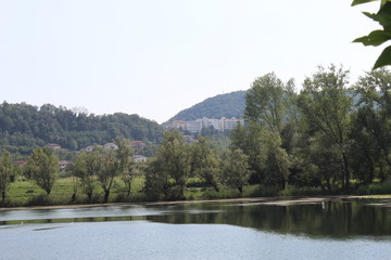 Fototapeta premium Mountain view by Revine lake (landscape,sky,nature,blue,river,panorama,travel,reflection)