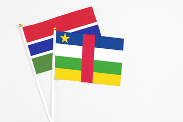 Central African Republic and Georgia stick flags on white background. High quality fabric, miniature national flag. Peaceful global concept.White floor for copy space.